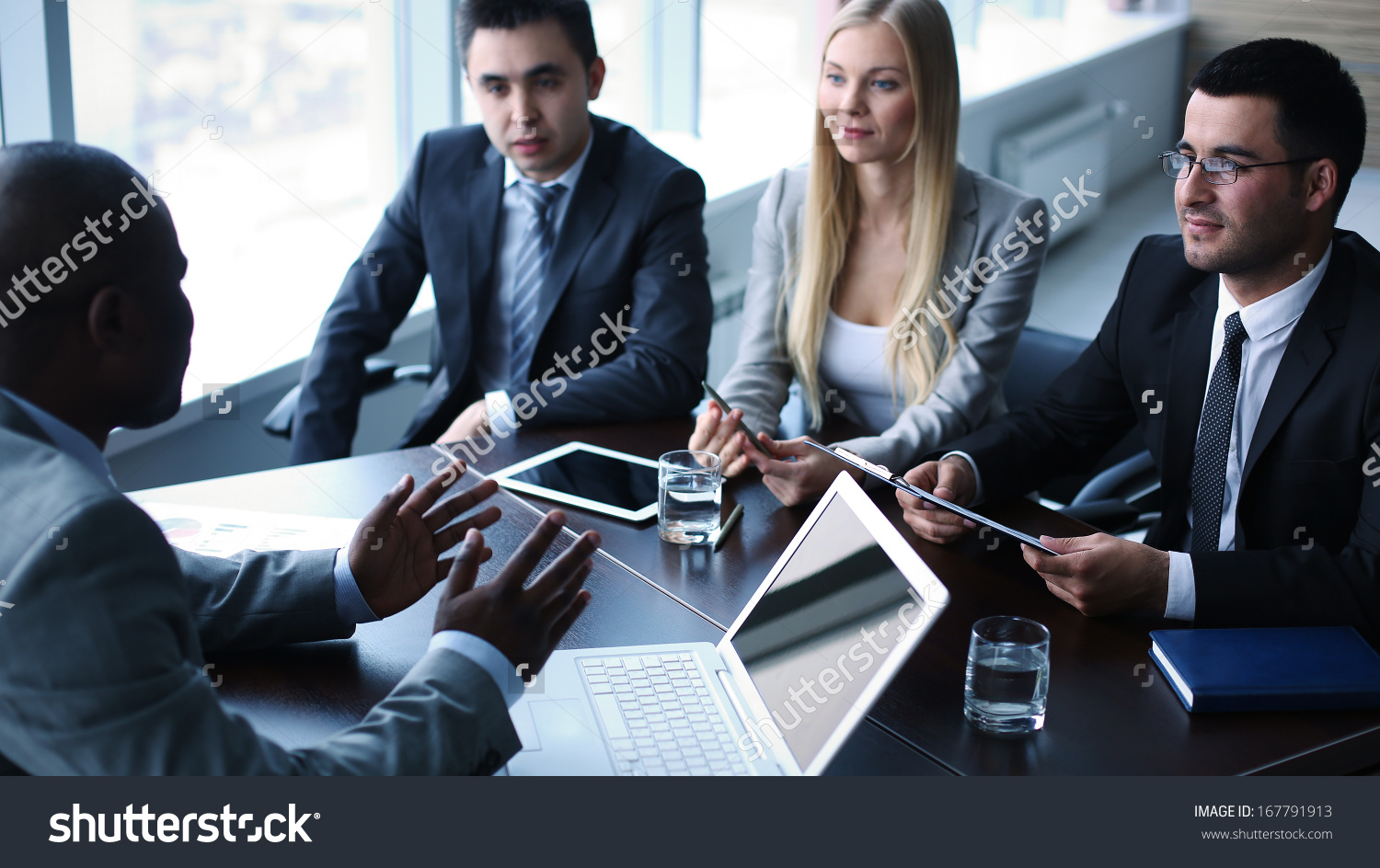 stock-photo-image-of-business-people-interacting-at-meeting-167791913 ...